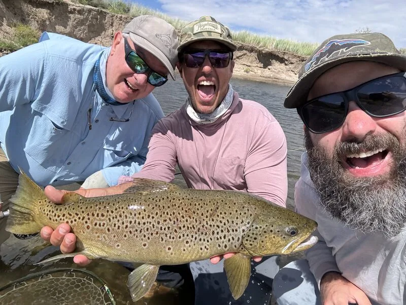 Brett Seng with clients having fun on the river